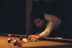 Smokey taking pool shot
